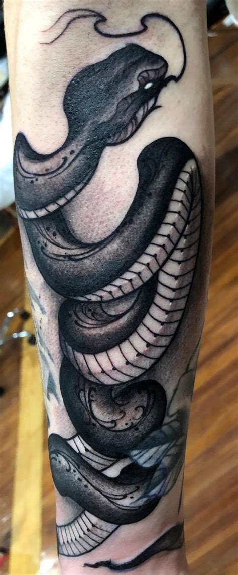 black and grey snake tattoo.